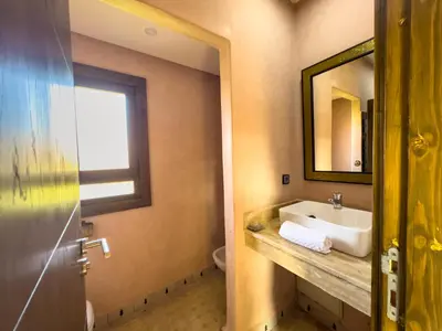 a bathroom with a sink and a mirror at Riad Tonaroz in Marrakech