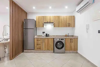 a kitchen with a refrigerator and a washing machine at New ! Logement Chic, Emplacement Idéal in Marrakech
