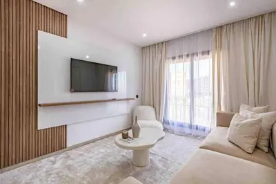 a living room with a couch and a tv at New ! Logement Chic, Emplacement Idéal in Marrakech