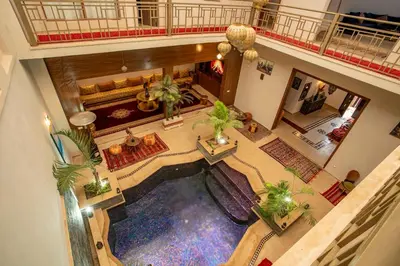 an overhead view of a hotel lobby with a pool at Riad Kenza in Marrakech