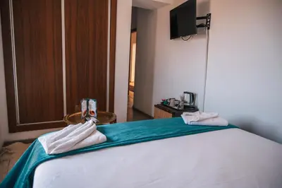 a bedroom with a bed with towels on it at Riad Kenza in Marrakech