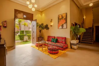 a living room with a couch and a table at Riad Azia in Marrakech