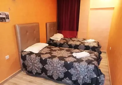 two beds in a small room at Hostel Ghali & Private Rooms Gueliz in Marrakech