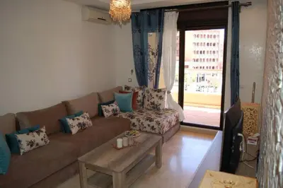 a living room with a couch and a table at Residence Miramas 2 D in Marrakech