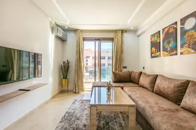 a living room with a couch and a table at New ! Appartement Bella ,Terrasse,Fibre Obtique in Marrakech