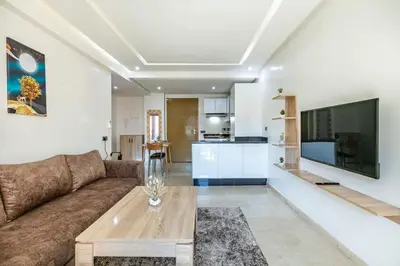 a living room with a couch and a table at New ! Appartement Bella ,Terrasse,Fibre Obtique in Marrakech