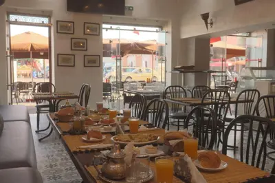 a table with food on it in a restaurant at HOTEL CTM in Marrakech