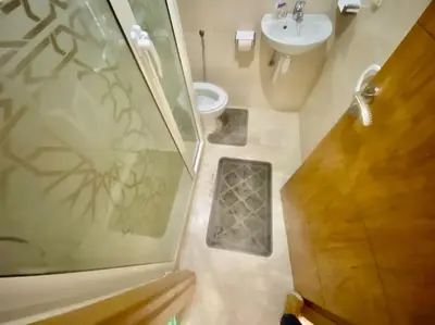 a bathroom with a shower and a toilet and a sink at Studio cosy au centre de Marrakech in Marrakech