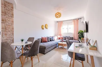 a living room with a couch and a table at Marrakech kamed home in Marrakech