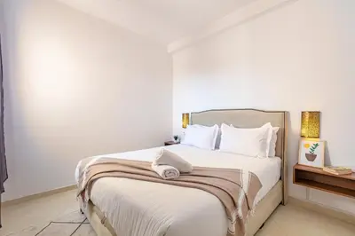 a bedroom with a large bed with white sheets and pillows at Marrakech kamed home in Marrakech