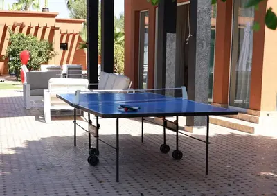 a blue ping pong table in front of a building at Domaine K Marrakech in Marrakech