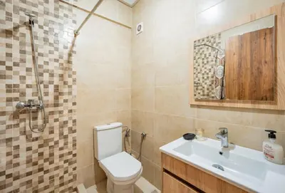 a bathroom with a toilet and a sink and a shower at appartement piscine proche gare in Marrakech