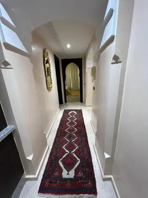 a hallway with a red rug on the floor at Luxury apartment 3 in the heart of Gueliz, Wifi, Pool in Marrakech