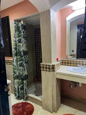 a bathroom with a sink and a shower with a mirror at Luxury apartment 3 in the heart of Gueliz, Wifi, Pool in Marrakech