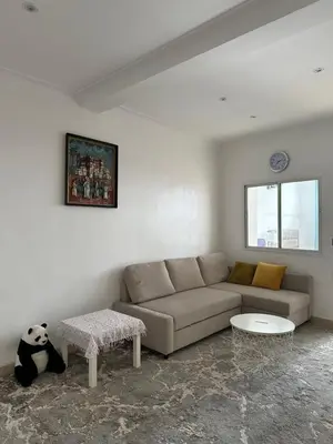a living room with a couch and a panda bear at Gueliz Center Home (Starbucks) in Marrakech