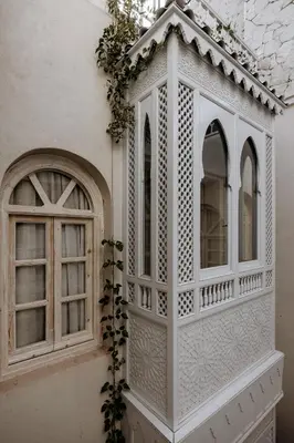 a white cabinet on the side of a building at Riad K-white in Marrakech