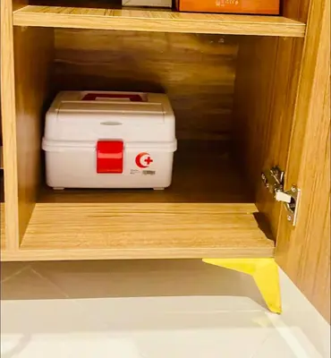 a toaster is sitting inside of a wooden cabinet at Stay In Marrakech Blue Appartment in Marrakech