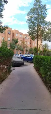 a blue car parked in front of a building at Lucky Nest apartment À Bassatine targa Marrakech à proximité de Hammam Zinaya in Marrakech