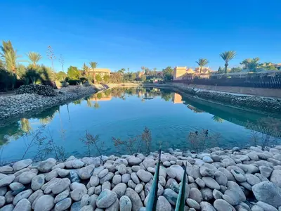 a river with rocks in the middle of it at Les Fleurs du Bien - Marrakech in Marrakech