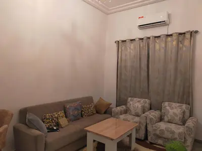 a living room with a couch and two chairs at MyZo Superbe Appartement familial bien situé à Marrakech in Marrakech