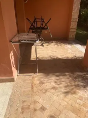 a chair sitting on top of a patio at Merveilleuse Marrakech! in Marrakech