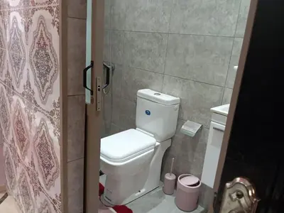 a bathroom with a white toilet in a room at Redone in Marrakech