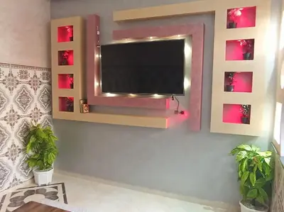 a living room with a flat screen tv on a wall at Redone in Marrakech