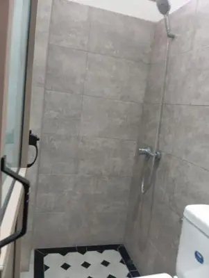 a bathroom with a shower with a toilet at Redone in Marrakech