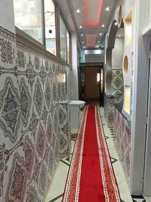 a red carpet on the floor in a hallway at Redone in Marrakech