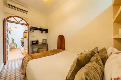 a bedroom with a white bed and a window at Little Riad 3 Rooms - Top emplacement 5 minuts from Place Jemaa el fna & souk in Marrakech