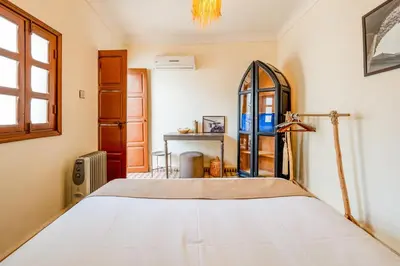 a bedroom with a bed and a window at Little Riad 3 Rooms - Top emplacement 5 minuts from Place Jemaa el fna & souk in Marrakech
