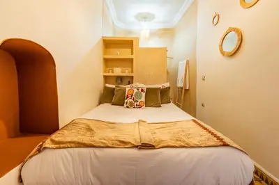 a small bedroom with a bed in a room at Little Riad 3 Rooms - Top emplacement 5 minuts from Place Jemaa el fna & souk in Marrakech
