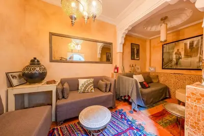 a living room with two couches and a table at Little Riad 3 Rooms - Top emplacement 5 minuts from Place Jemaa el fna & souk in Marrakech