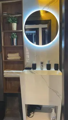 a bathroom with a white sink and a mirror at Résidence Elsalam Marrakech in Marrakech