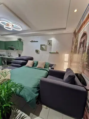 a living room with a bed and a couch at Marrakeschzentrum Hideaway in Marrakech