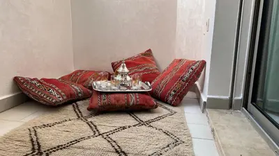 a room with four red pillows and a table at Marrakeschzentrum Hideaway in Marrakech
