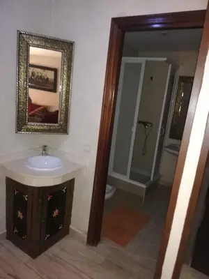 a bathroom with a sink and a mirror at RESIDENCE HAMZA Cosy appartement only family à Gueliz in Marrakech