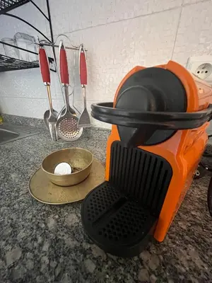 a kitchen counter with utensils on a counter top at Appartement aéroport Marrakech in Marrakech