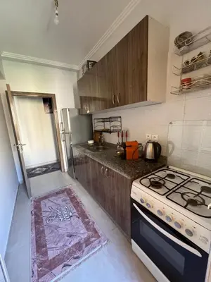 a kitchen with a stove and a stove top oven at Appartement aéroport Marrakech in Marrakech