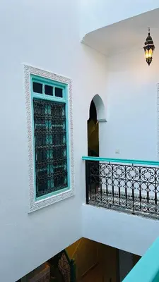 a stairway with a window and a balcony at DAR AL NOUR in Marrakech