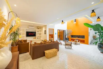 a living room with a couch and a fireplace at RIAD LE M neuf et contemporain in Marrakech