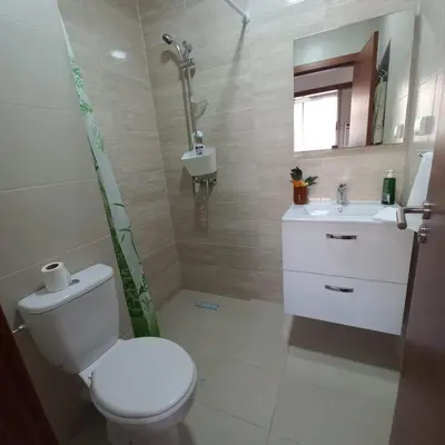 a bathroom with a toilet and a sink at Appartement de luxe Prestigia in Marrakech
