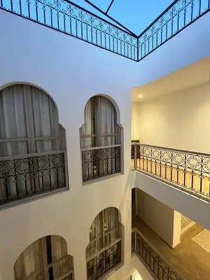 an empty building with balconies and a ceiling at Riad KaBaYa Charme Exclusif Privatisé 2 à 8 Pers. in Marrakech