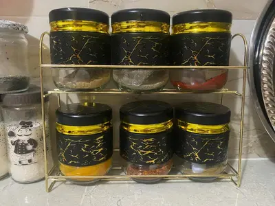 a shelf filled with jars of food in a refrigerator at Riad Atlas avec jacuzzi 3 piscines au cœur de Marrakech in Marrakech