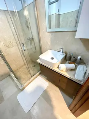 a bathroom with a sink and a shower at Pearl Garden Studio Cozy Panoramic Charming sunny Terrace Piscine in Marrakech