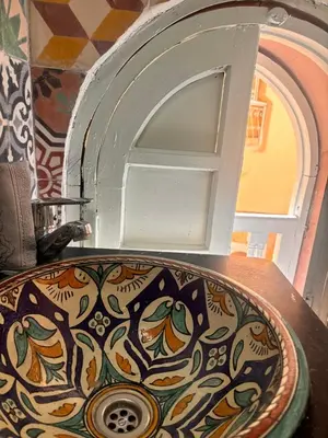a sink in a room with an opening in the wall at Riad Sanwa in Marrakech