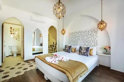a bedroom with a large white bed in a room at Villa Serenity & SPA - Breakfast in Marrakech