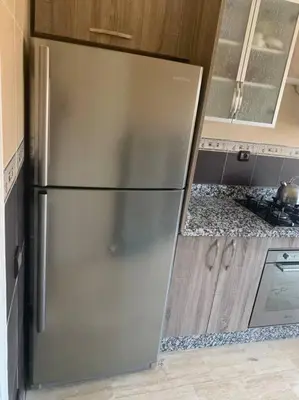 a stainless steel refrigerator in a kitchen at Luxury, Cosy Apartement (Wifi, Balcony, Parking) in Marrakech
