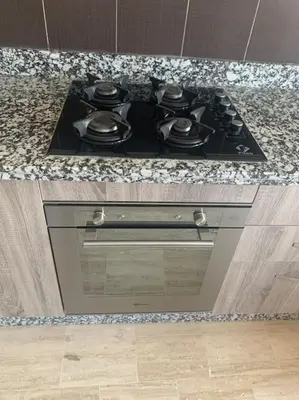 a stove top with pots and pans on top of it at Luxury, Cosy Apartement (Wifi, Balcony, Parking) in Marrakech
