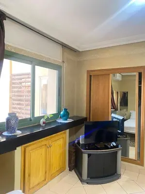 a kitchen with a counter top and a window at superbe appartement à Gueliz in Marrakech